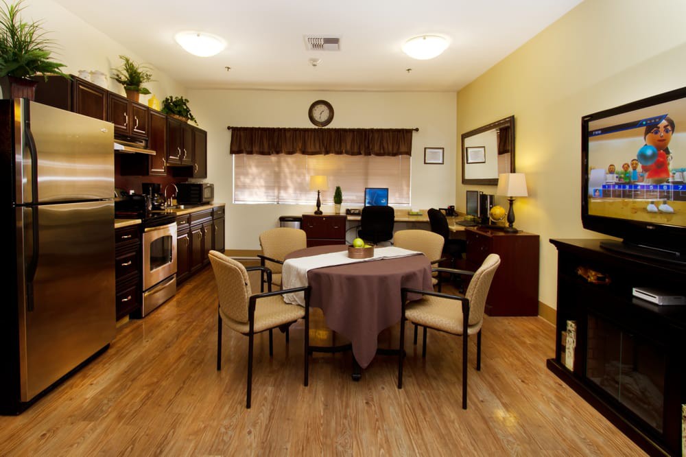 Cozy kitchen and dining area with modern furnishings and warm lighting.