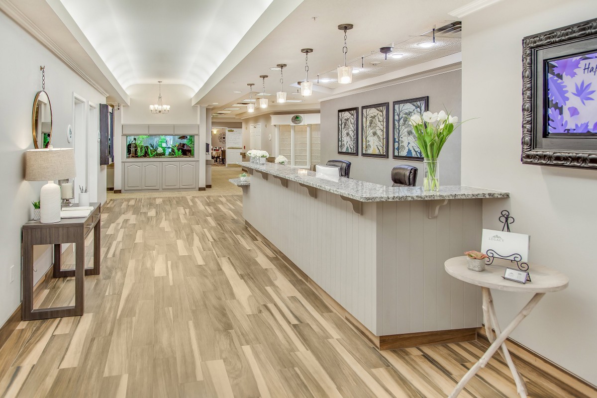 Modern reception area with a sleek desk and stylish lighting.