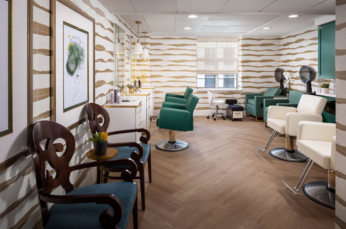 A well-designed hair salon interior featuring comfortable chairs and stylish decor.