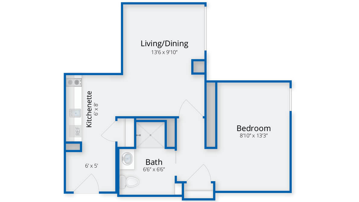 Floor plan of a one-bedroom apartment with a living/dining area, kitchenette, and bathroom.