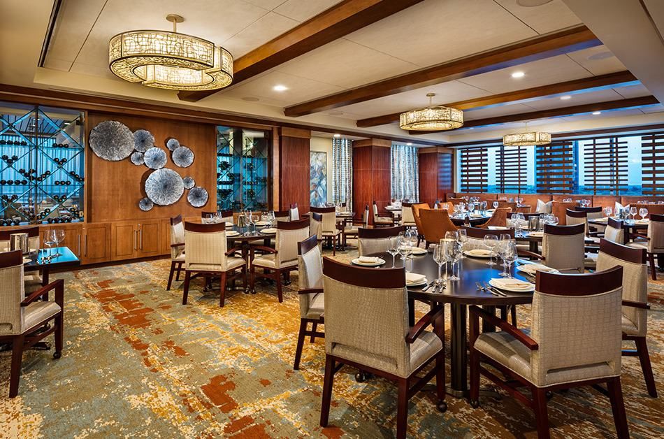 An elegant dining room with neatly arranged tables and stylish decor.