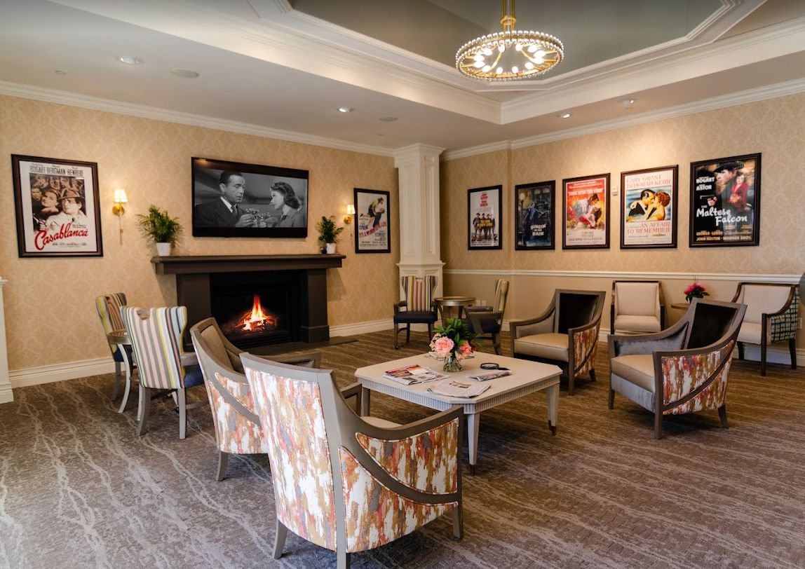 Cozy lobby with a fireplace and comfortable seating arrangement.