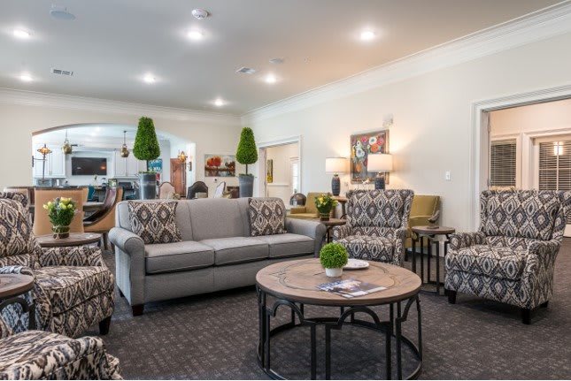 A well-furnished living room featuring comfortable seating and stylish decor.