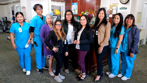 A cheerful team gathered in a professional setting, showcasing camaraderie and diversity.