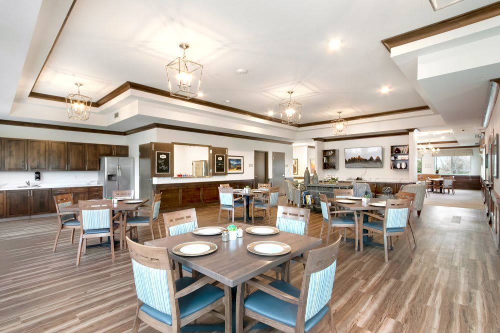 A modern dining area with elegant lighting and stylish furniture.