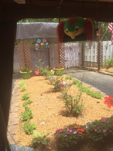 A serene garden view showcasing vibrant flowers and well-maintained landscaping.