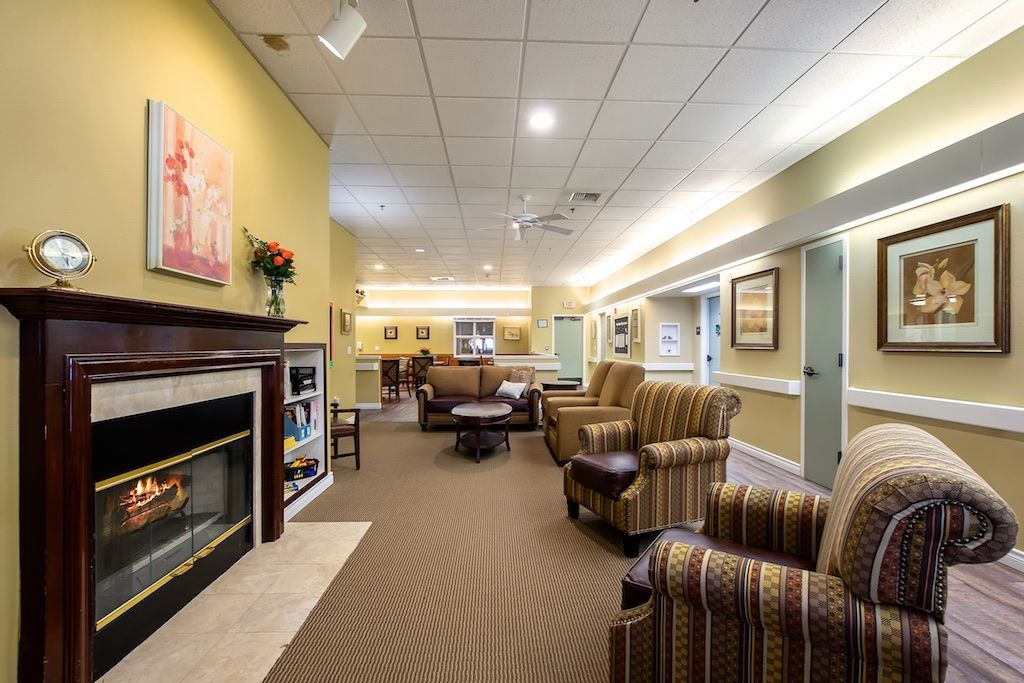A cozy living room with comfortable seating and a fireplace.