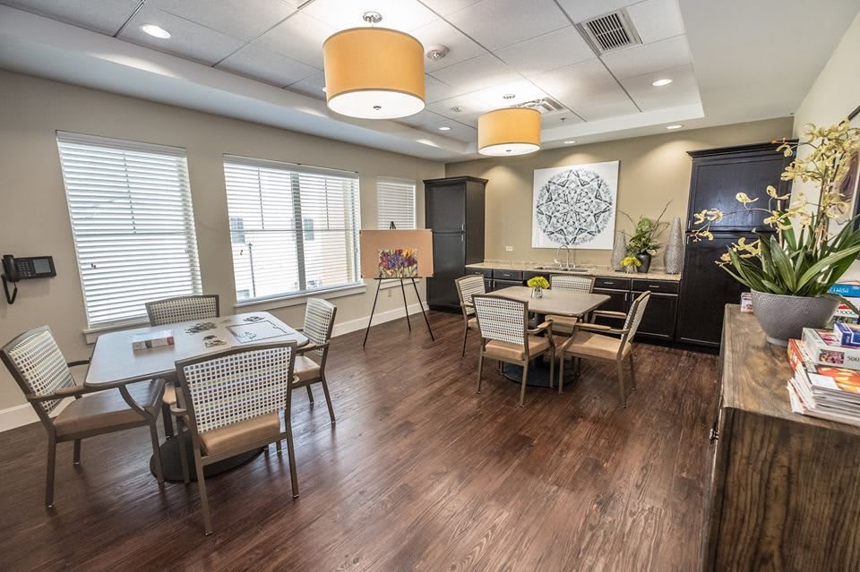 A modern dining area with stylish furniture and warm lighting.
