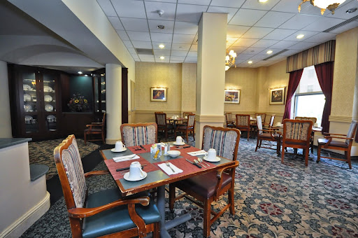 A cozy dining area with elegantly set tables, perfect for intimate meals.