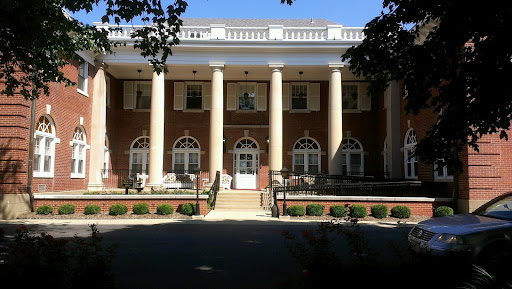 A grand building featuring classic architecture with prominent columns and detailed windows.