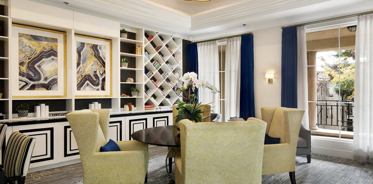 Elegant living room with comfortable seating and a built-in wine rack.