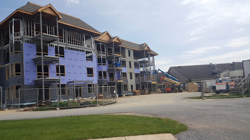 A construction site featuring a multi-story building under development.