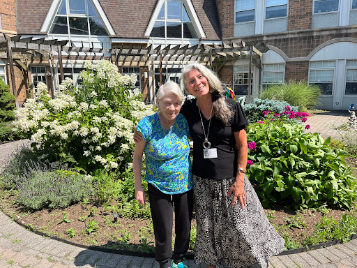A joyful moment shared in a beautiful garden.
