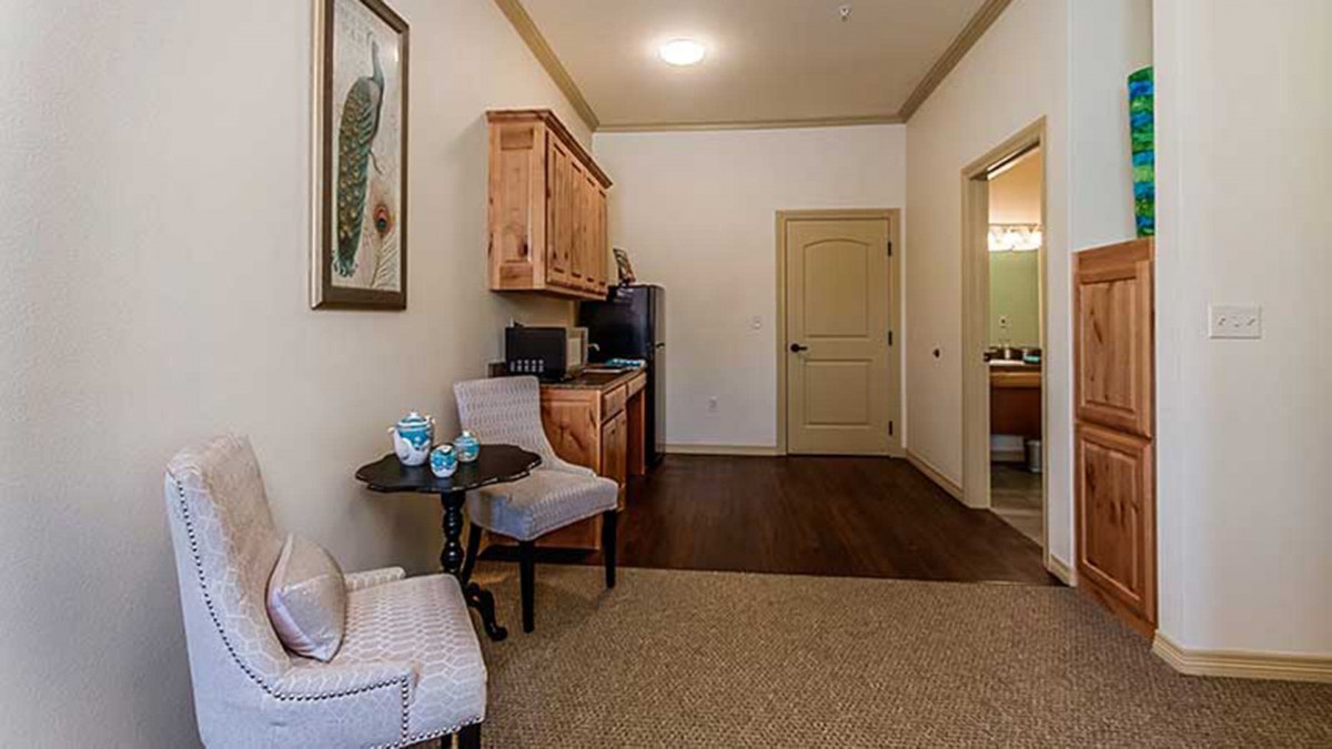 Cozy living area with a kitchenette and comfortable seating.