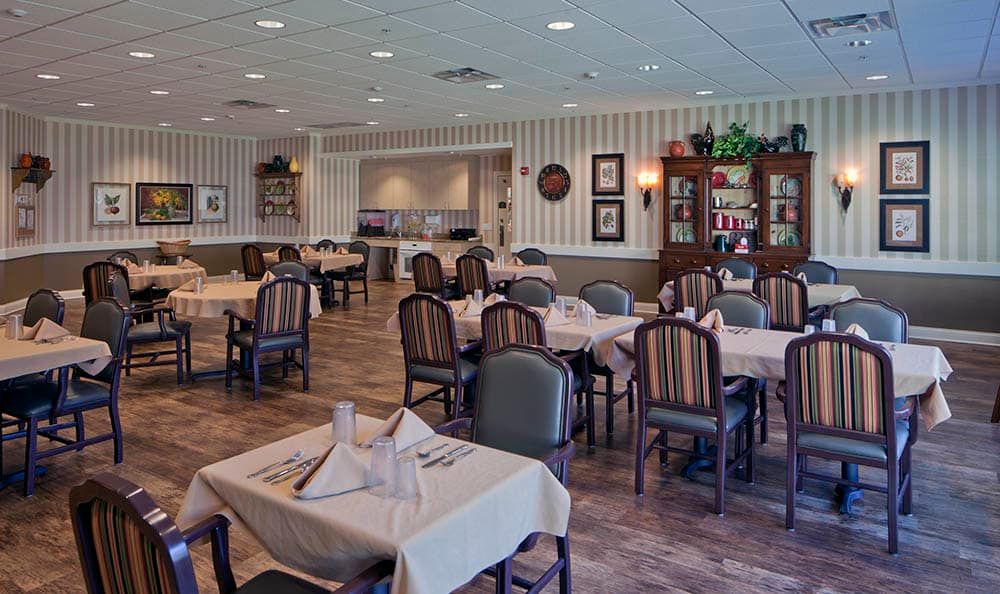 A well-arranged dining area with neatly set tables in a restaurant.