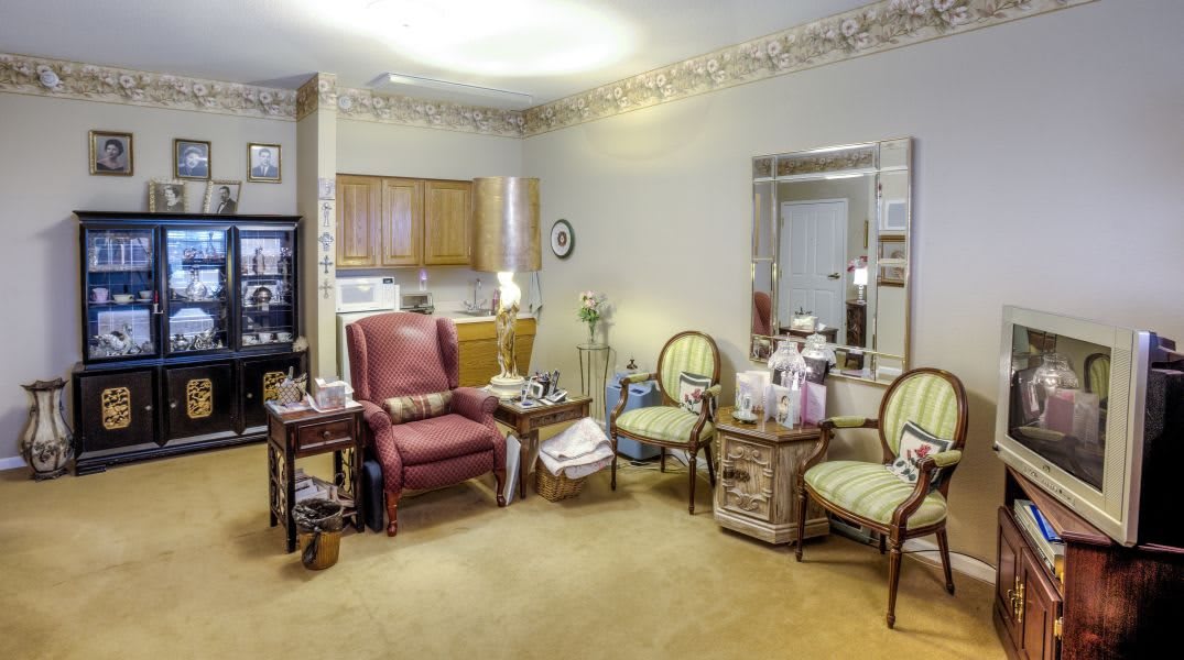 A cozy and traditional living room with comfortable seating and warm decor.