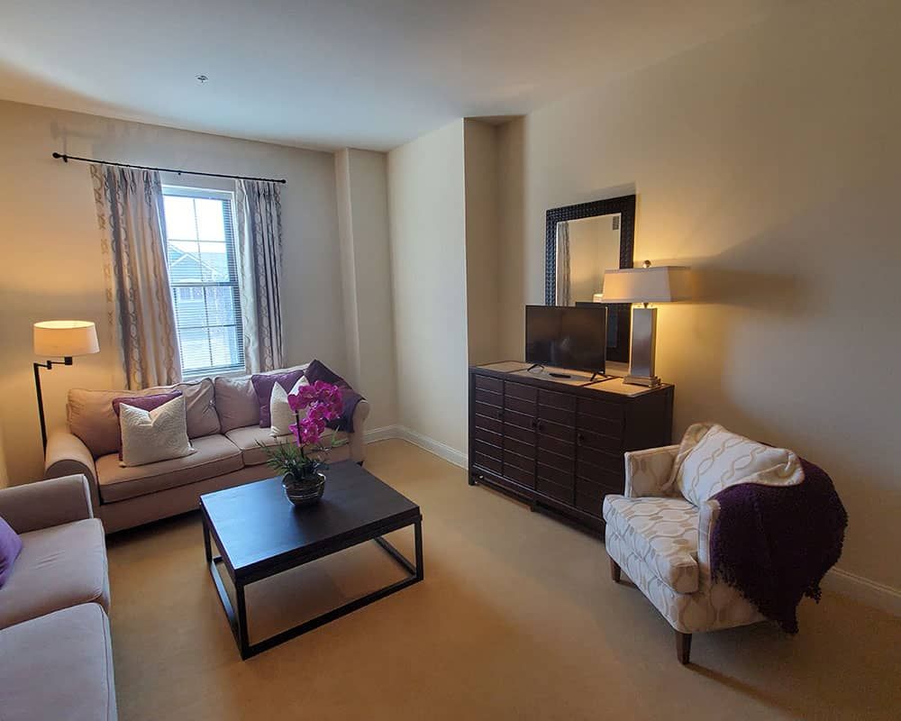 A cozy living room with elegant furniture and decor.