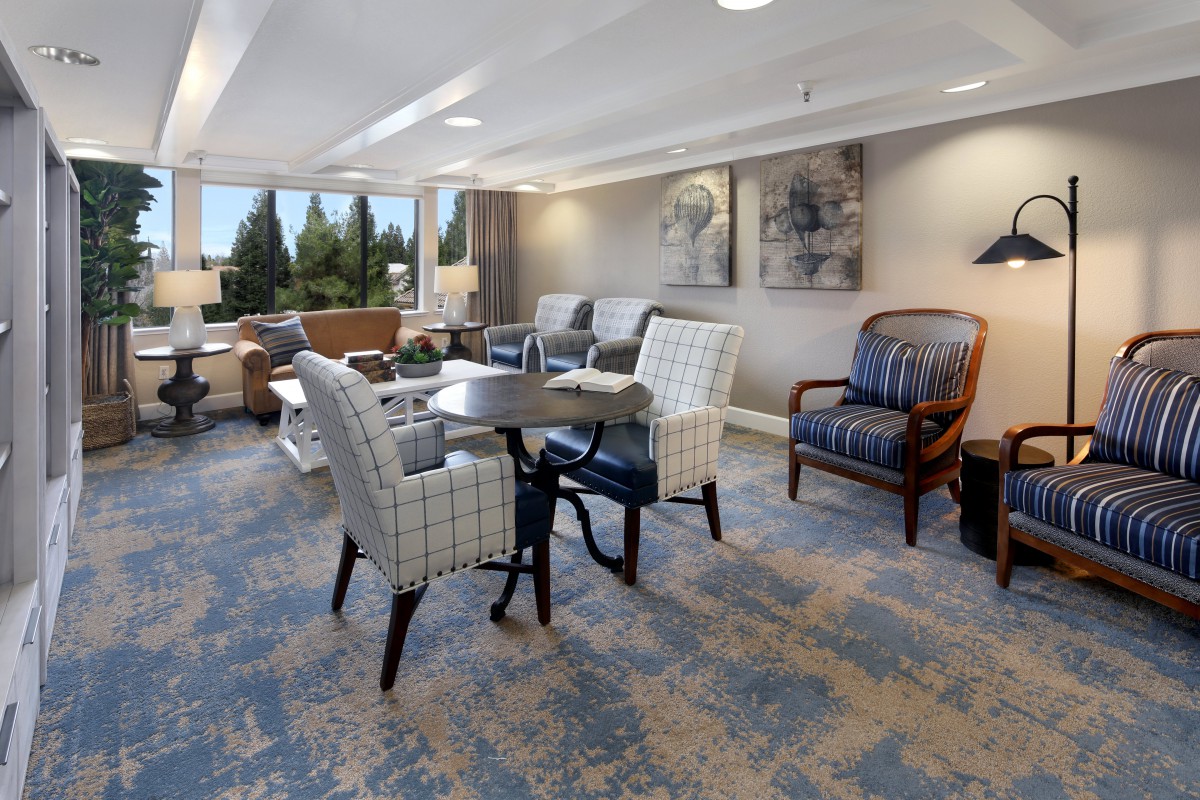 A cozy living room with comfortable seating and large windows.
