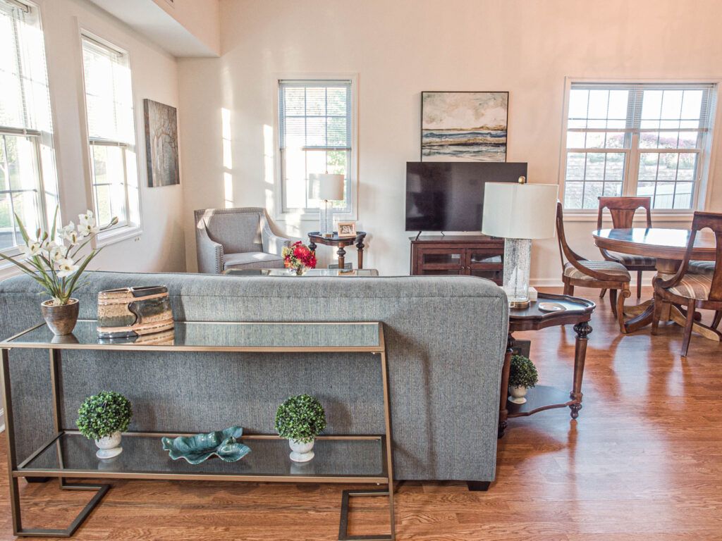 A cozy living room with modern furniture and decor.