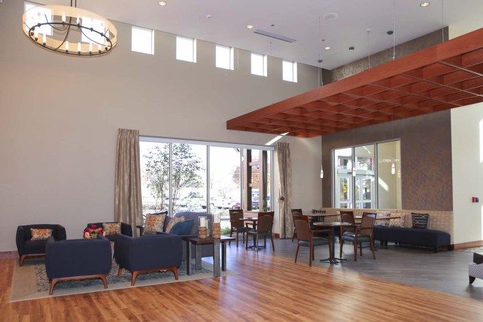 A modern lounge area with ample seating and natural light.