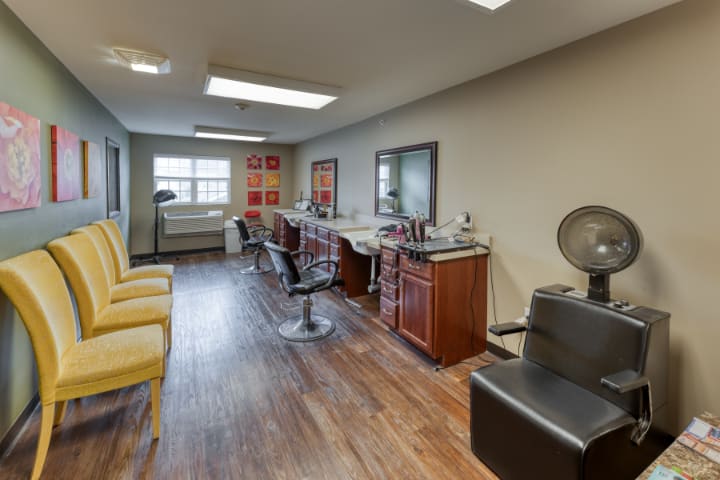 A professional salon interior with styling chairs and mirrors.