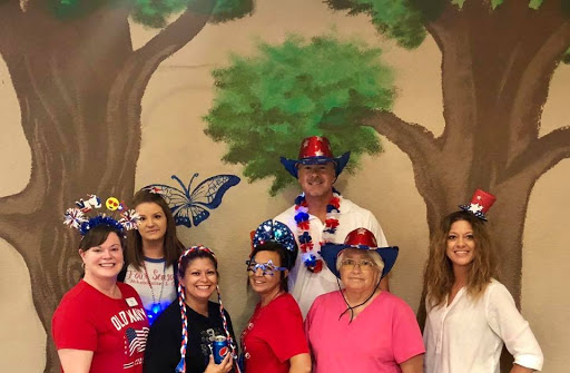 A joyful gathering celebrating with festive outfits and decorations.