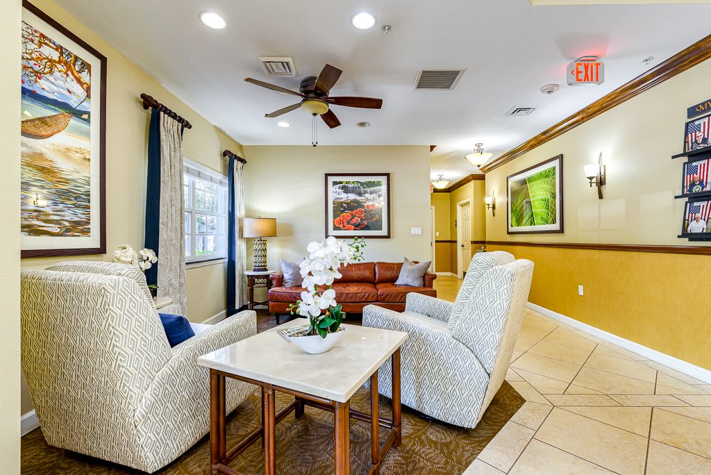 A cozy living room with comfortable seating and elegant decor.