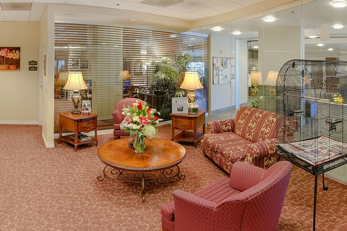 A cozy lobby with comfortable seating and warm lighting.