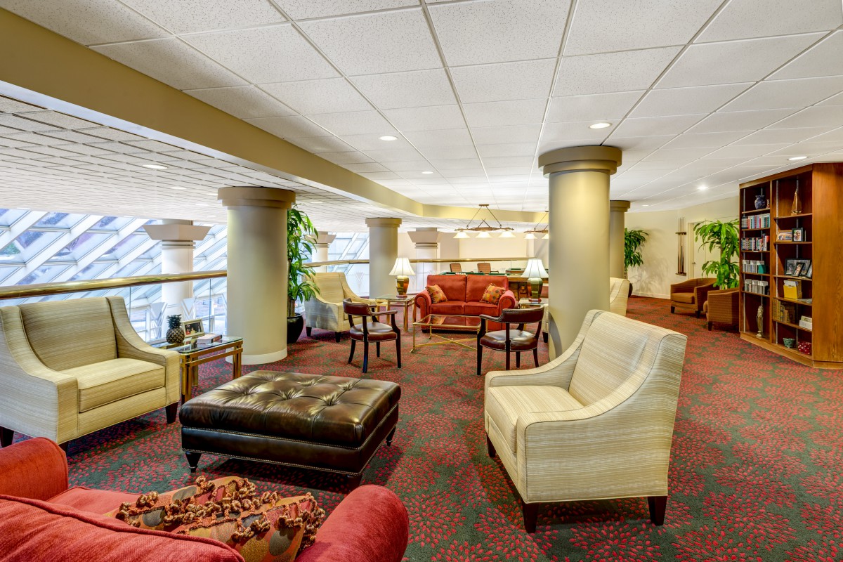 A spacious hotel lobby with comfortable seating and elegant decor.