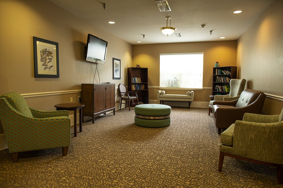A cozy living room with comfortable seating and a television.