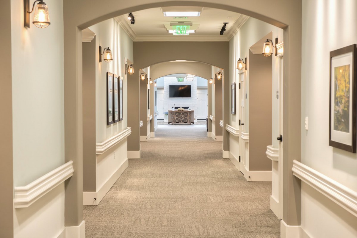 A well-lit and elegantly designed hallway with modern interior elements.