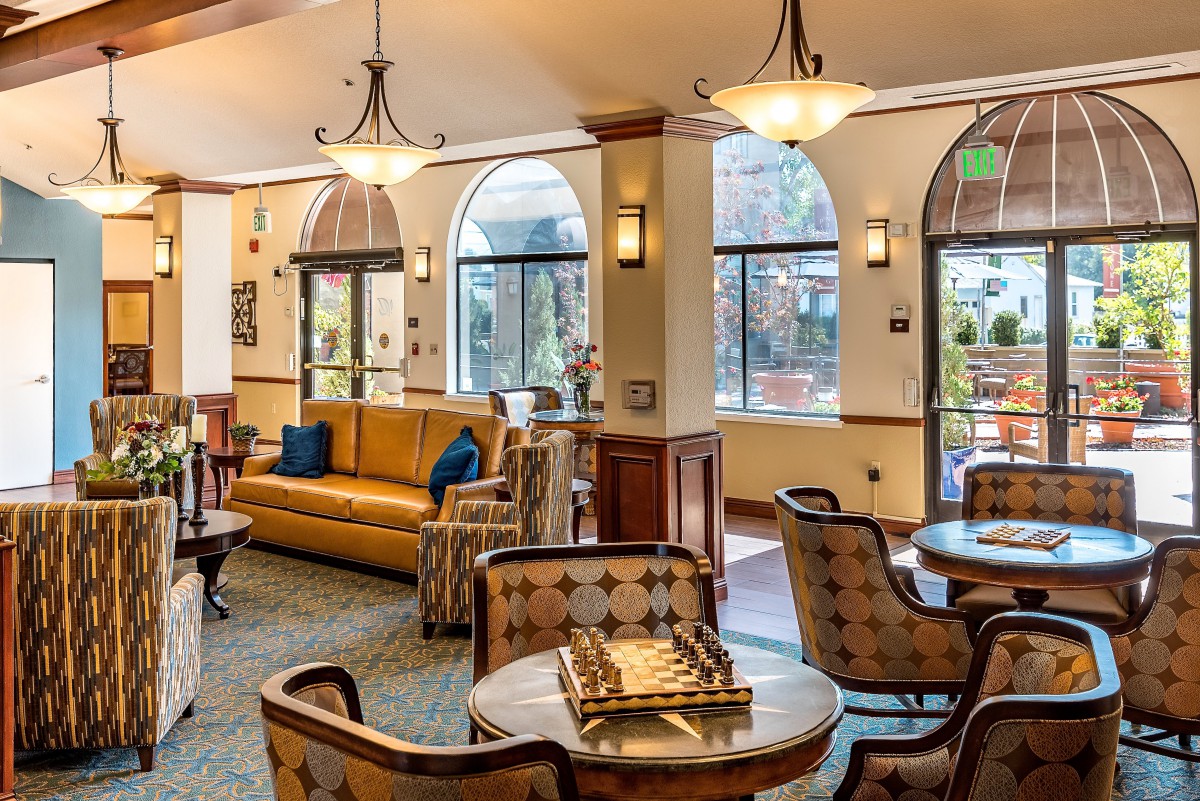A cozy lobby with comfortable seating and warm lighting.