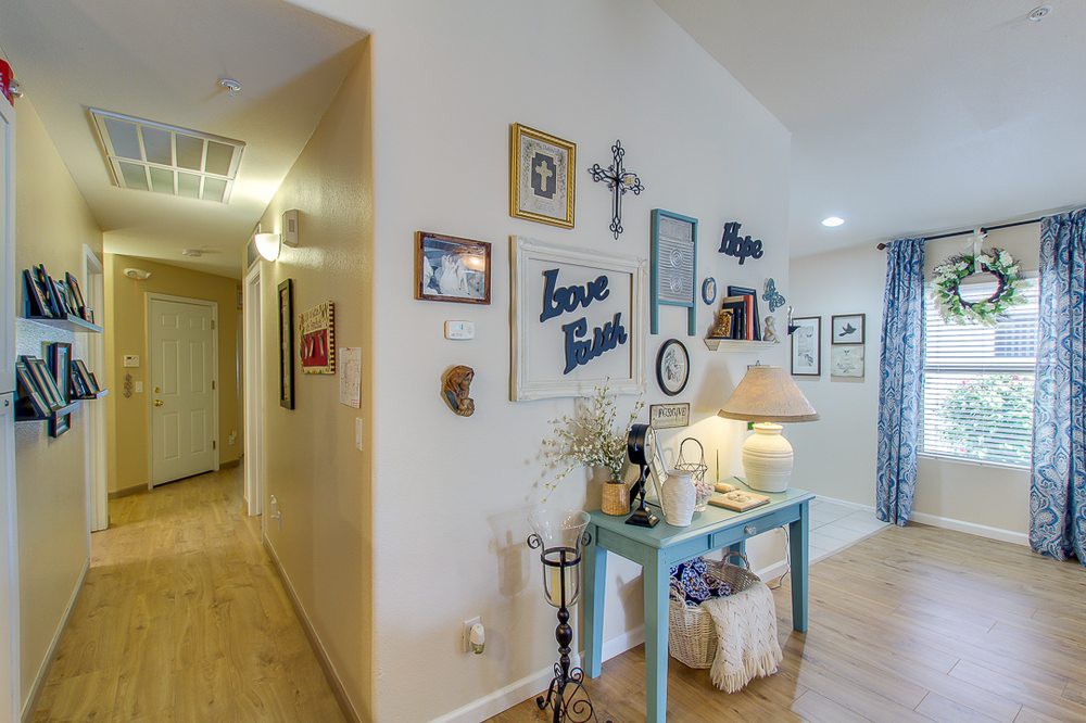 A cozy hallway adorned with wall art and a console table, showcasing personalized home decor.