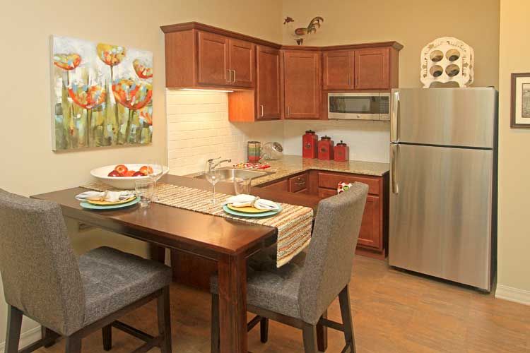 Cozy kitchen with a dining setup and modern appliances.