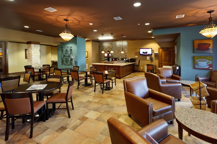 A modern lounge with comfortable seating and elegant decor.