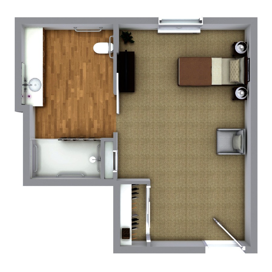 A floor plan of a compact one-bedroom apartment with distinct living and kitchen areas.