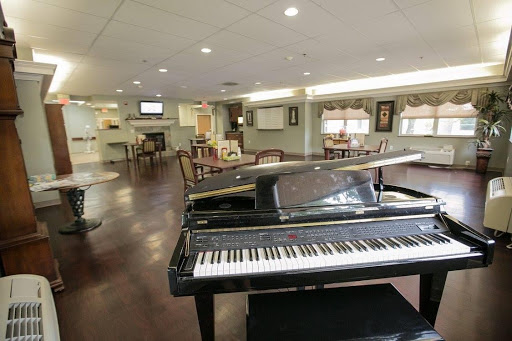 A cozy lounge area featuring a grand piano, perfect for music lovers.