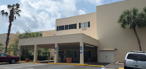 A view of a healthcare facility showcasing its entrance and architectural design.