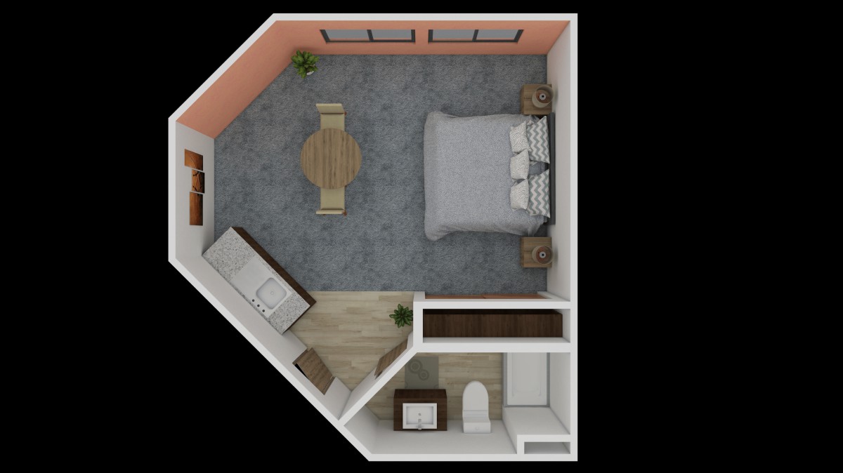 A top-down view of a bedroom floor plan with a bed, couch, table, and bathroom.