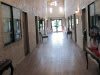 A modern hallway with bright lighting and contemporary decor.