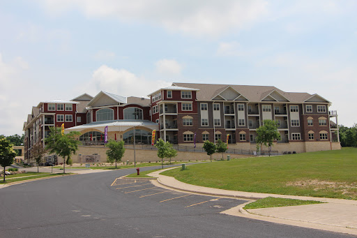 A modern residential apartment complex with landscaped surroundings.