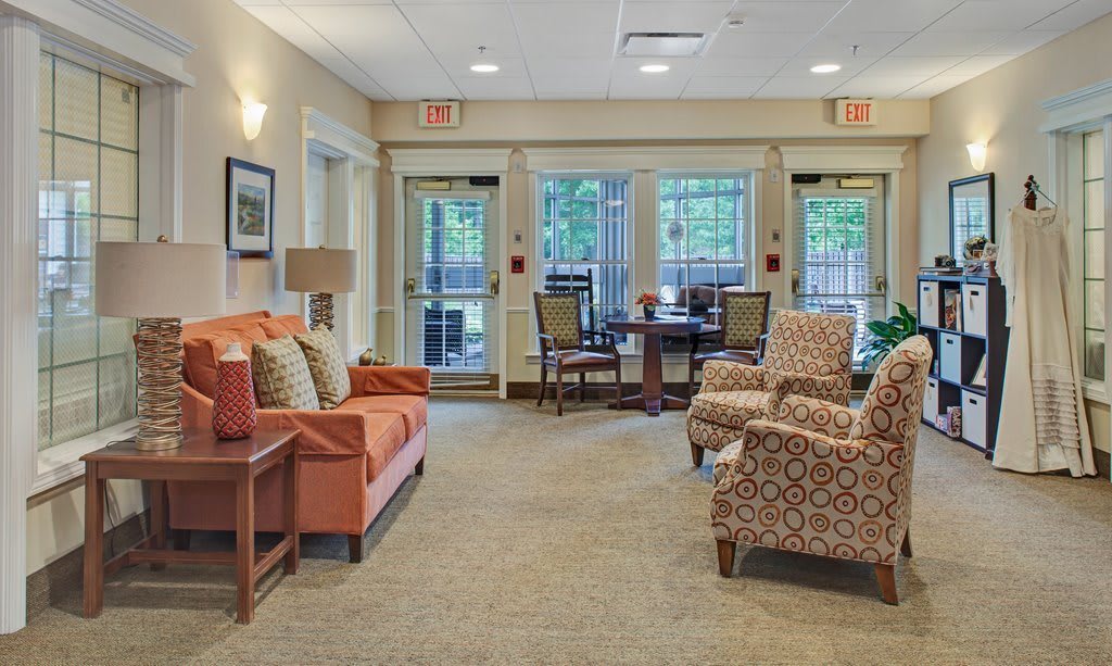 A cozy lounge with comfortable seating and decor.