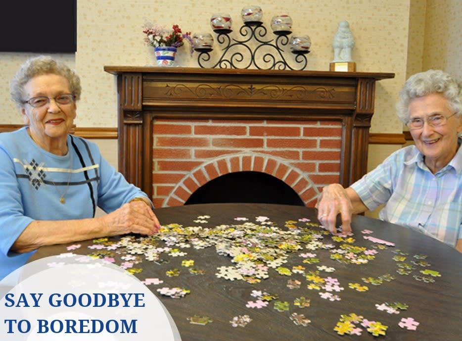 Seniors enjoying a puzzle activity together.
