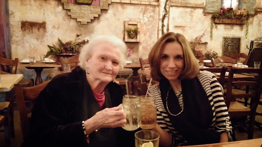 A joyful moment shared over drinks at a cozy restaurant.