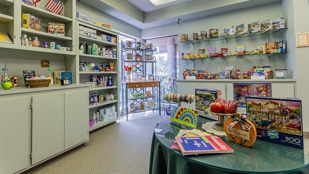 Interior of a small gift shop with shelves displaying various toys and gifts.