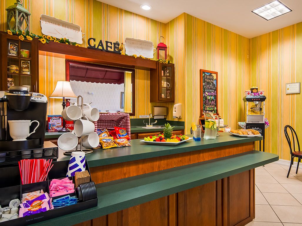 A cozy cafe with a variety of snacks and beverages displayed on the counter.