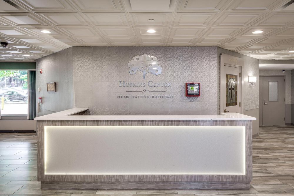 A modern reception desk in a lobby with elegant interior design.