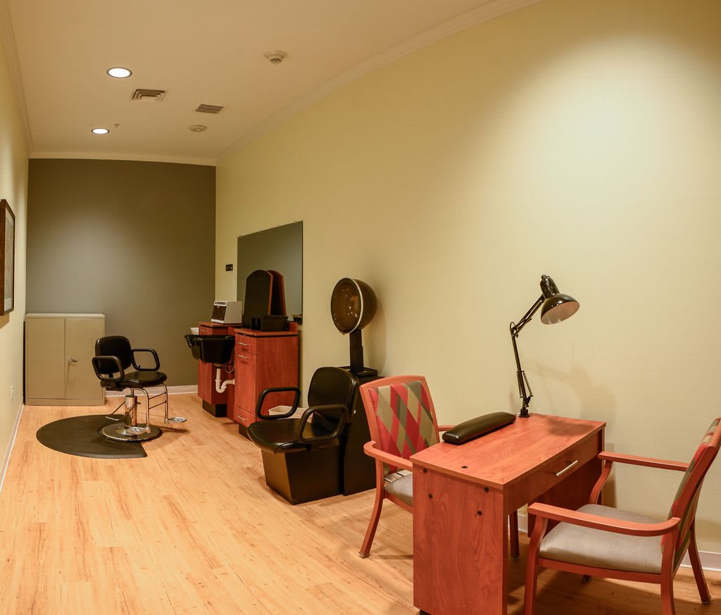 An empty salon with chairs and a desk, ready for clients.