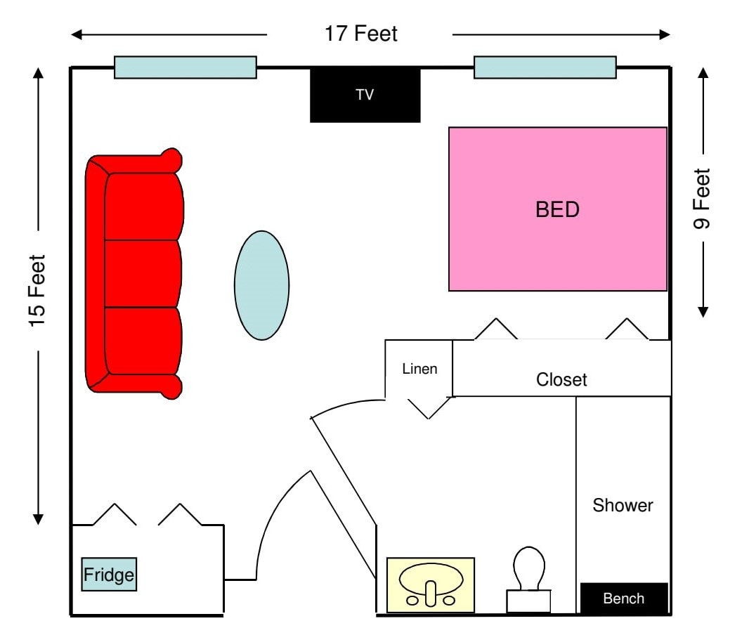 A floor plan of a bedroom and living area with labeled furniture.