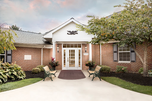 Welcoming entrance of a charming brick building.